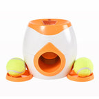 Lance-balles automatique pour chien blanc et orange avec balles vertes