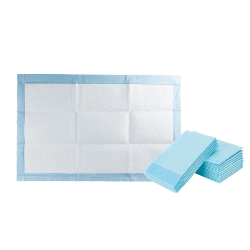 Tapis absorbants pour chien bleu clair rectangulaires, lot empilé, vue d’ensemble