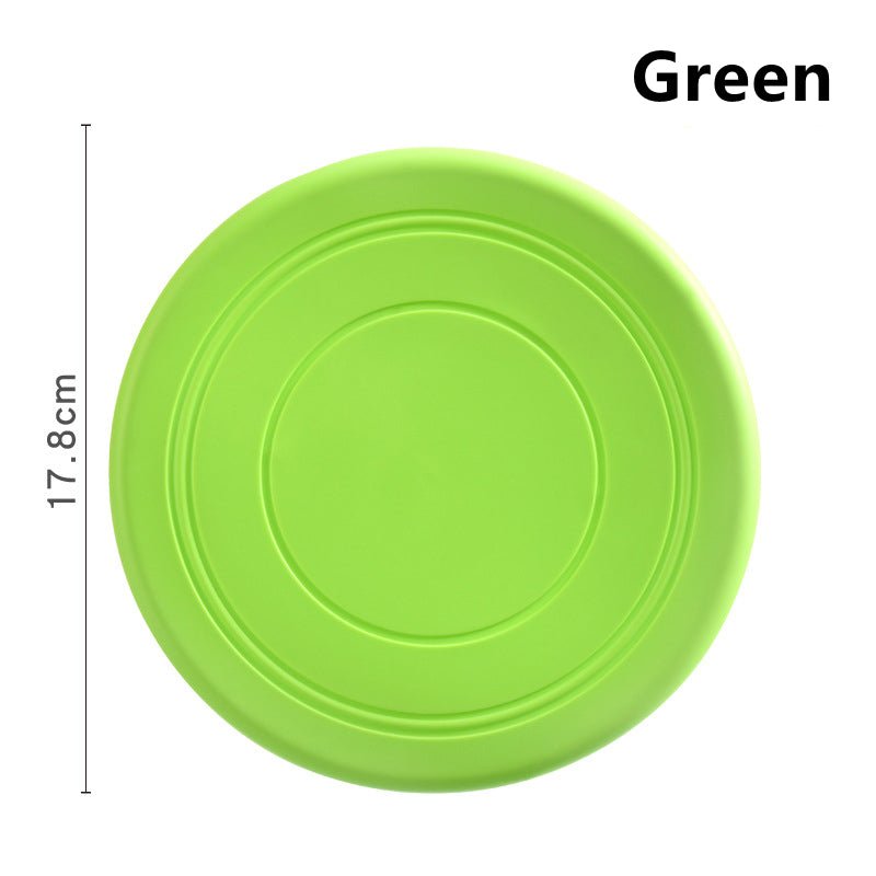 Disque frisbee flottant vert pour chien, rond avec rainures concentriques.